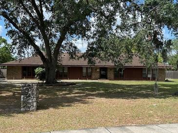 Charming single-story home with a well-maintained lawn and mature trees offering plenty of shade at 1500 Markham Woods Rd, Longwood, FL 32779