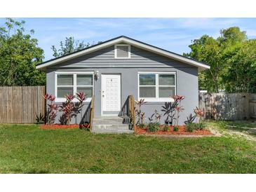 Charming home featuring updated siding, complemented by fresh landscaping and a well-maintained lawn at 3151 S Bumby Ave, Orlando, FL 32806