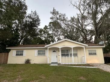 Charming single-story home with a well-maintained front yard and cozy porch at 6427 Breezewood St, Orlando, FL 32818