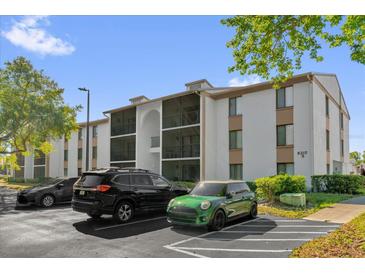 Well-maintained condo building with screened balconies and assigned parking in a quiet community at 8217 Sun Spring Cir # 41, Orlando, FL 32825