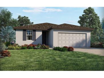 Beautiful single-story home featuring a two-car garage and a well-maintained lawn with charming landscaping at 3218 Viceroy Ct, Poinciana, FL 34759