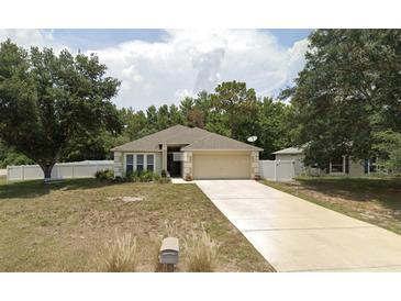 Charming one-story home with a well-manicured lawn and inviting curb appeal at 3020 Norlina St, Deltona, FL 32738