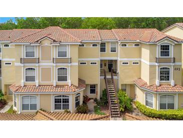 Inviting condo community showcases a well-maintained building with classic architectural details and a vibrant landscape at 692 Seabrook Ct # 103, Altamonte Springs, FL 32714