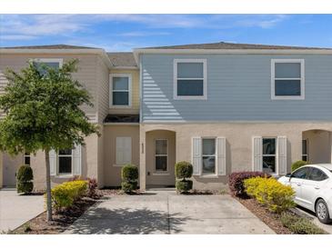 Charming two-story townhome with manicured landscaping, neutral color palette, and a private driveway at 4732 Coral Castle Dr, Kissimmee, FL 34746