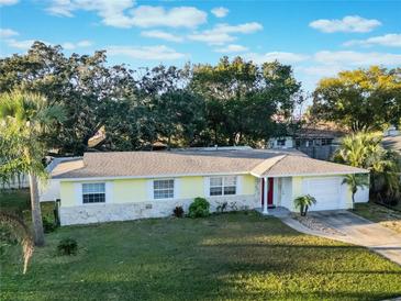 Charming single-story home with a well-manicured lawn and mature trees in a desirable neighborhood at 2070 Keyes Ln, Deltona, FL 32738