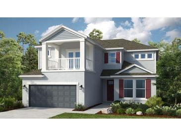 Charming two-story home with grey siding, red shutters, a covered balcony, and a two-car garage at 4716 Coral Harbour Rd, Kissimmee, FL 34758