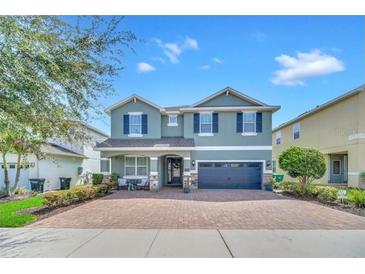 Beautiful two-story home with a large driveway and well-maintained landscaping at 7503 Marker Ave, Kissimmee, FL 34747