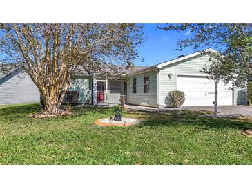 Charming single-story home with well-manicured lawn and attached one car garage at 840 Cortez Ave, The Villages, FL 32159