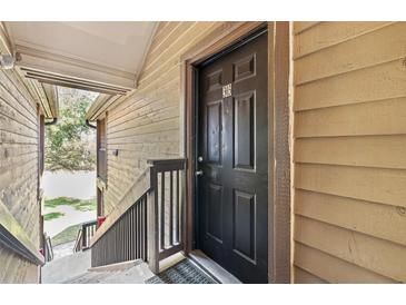 Close-up view of the unit's front door with the number 603 at 325 Lakepointe Dr # 303, Altamonte Springs, FL 32701