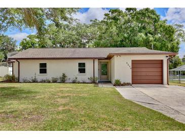 Charming single-story home featuring a well-maintained lawn and a one-car garage at 1179 Shadow Run Dr, Lakeland, FL 33813