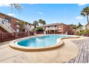 Enjoy the community pool with a well maintained deck and lounging area, perfect for relaxation and socializing at 480 Banyon Tree Cir # 100, Maitland, FL 32751