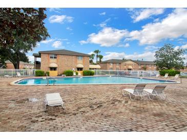 Enjoy the community pool with lounge chairs, perfect for relaxing on sunny days at 480 Banyon Tree Cir # 100, Maitland, FL 32751