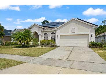Charming single-story home features a well-manicured lawn, solar panels and a two-car garage at 625 Waterland Ct, Orlando, FL 32828