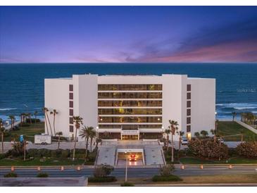Elegant condo building boasting ocean views, lush landscaping, and convenient underground parking at 901 S Atlantic Ave # 3, Ormond Beach, FL 32176