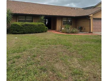 Charming single-story home with well-maintained landscaping and inviting front entrance at 277 South St, Fern Park, FL 32730