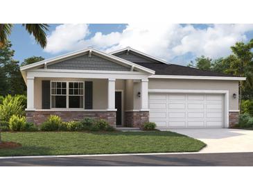 Charming single-story home with a two-car garage and manicured lawn at 10128 Huntingnet Way, Leesburg, FL 34748