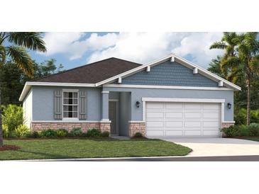 Charming single Gathering home showcases a two-car garage, stone accents, professional landscaping, and craftsman details at 10132 Huntingnet Way, Leesburg, FL 34748
