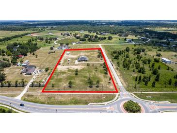 Expansive aerial view of the property showcasing the well-manicured grounds and neighborhood surroundings at 11400 Lovers Ln, Winter Garden, FL 34787