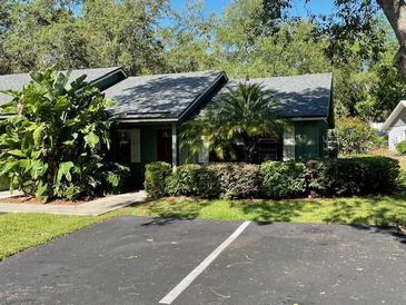 Charming home with well-maintained landscaping, lush greenery, and a private parking area in a quiet neighborhood at 622 Mount Homer Rd # 622, Eustis, FL 32726