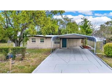 Charming single-story home with a covered carport and well-maintained front yard at 1805 Knox Ave, Sanford, FL 32771