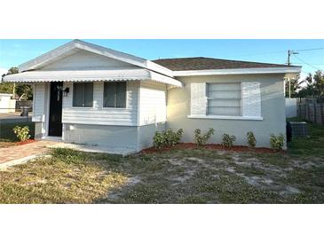 Charming single story home featuring a covered entry and landscaped yard at 2975 Avenue G Nw, Winter Haven, FL 33880