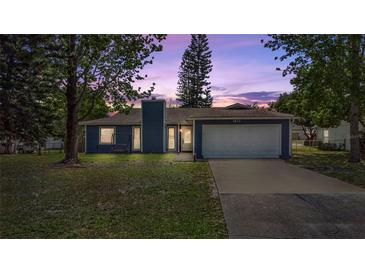 Charming single Gathering home featuring a two-car garage and a well-maintained lawn at 1831 W Clinton Dr, St Cloud, FL 34769