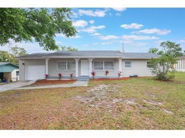 Charming single-story home with a well-maintained lawn and inviting front porch at 2113 Winnetka Ct, Orlando, FL 32818