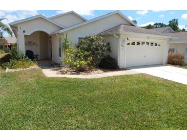 Inviting single-story home with a well-manicured lawn and charming curb appeal at 236 Ridge View Dr, Davenport, FL 33837