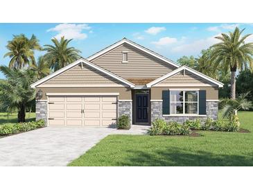 Charming single-Gathering home showcasing a two-car garage, stone accents, and tropical landscaping at 33656 Seattle Slew Dr, Sorrento, FL 32776
