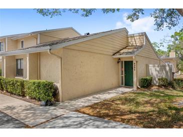 Inviting home featuring manicured landscaping and a charming entranceway, perfect for a cozy and welcoming curb appeal at 5395 Emerald Isle Drive # 1011, Orlando, FL 32812
