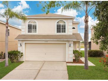 Charming two-story home with well-maintained lawn and two-car garage at 1556 Sherbourne St, Winter Garden, FL 34787