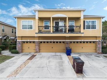 Charming multi-Gathering home featuring a second-story balcony and attached garages at 2256 Betsy Ross Ln, St Cloud, FL 34769
