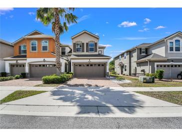 Charming two-story home featuring a two-car garage and brick-paved driveway at 3661 Brighton Park Cir, Orlando, FL 32812