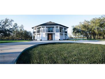 Beautiful octagonal home with a unique design, complemented by a well-manicured lawn, lush landscaping, and scenic views at 32325 State Road 44, Eustis, FL 32736