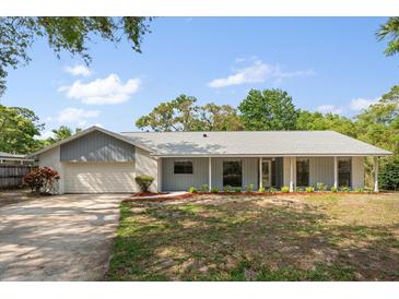 Charming single-story home features a well-maintained front yard and attached garage with lovely curb appeal at 345 W Hornbeam Dr, Longwood, FL 32779