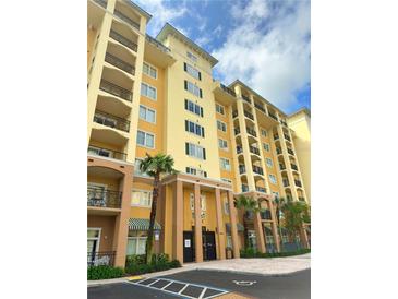 Inviting condominium featuring a meticulously kept exterior with a beautiful architectural design and lush landscaping at 8100 Poinciana Blvd # 2109, Orlando, FL 32821