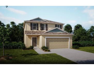 Charming two-story home with a two-car garage and beautifully landscaped front yard at 2783 San Marco Way, Winter Haven, FL 33884