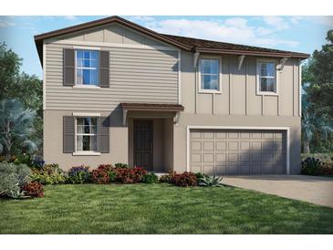 Charming two-story home featuring a neutral color palette, attached garage, and well-manicured lawn at 4721 Jasmine Cir, Leesburg, FL 34748