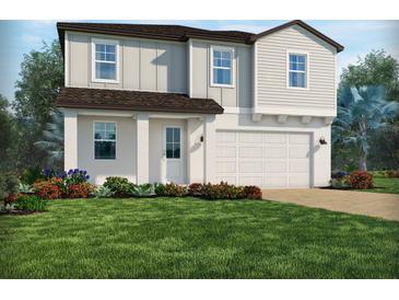 Charming two-story home with an attached two-car garage and a beautifully landscaped front yard at 2248 Hen Rd, Minneola, FL 34715