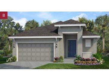 Charming one-story home featuring a two-car garage, neutral paint, and a well-manicured lawn at 503 Silver Palm Dr, Haines City, FL 33844