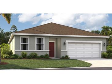 Charming single-story home with a red door, a two-car garage and manicured lawn at 397 Shoreview Sands Ave, Mascotte, FL 34753