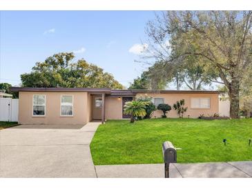 Charming single-story home with well-maintained lawn and inviting curb appeal at 1725 Marcia Dr, Orlando, FL 32807