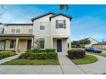 Charming two-story townhome features a well-manicured lawn and inviting entryway at 5089 Caspian St, St Cloud, FL 34771