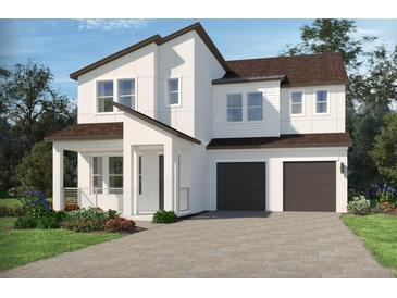 Charming two-story home with a contemporary design, two-car garage and well-manicured lawn at 5278 Citrus Leaf Blvd, Winter Garden, FL 34787