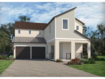 Charming two-story home featuring a two-car garage and covered entryway at 5307 Citrus Leaf Blvd, Winter Garden, FL 34787