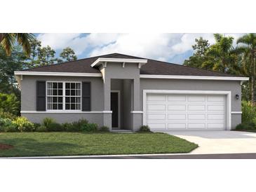 Charming single-story home featuring a manicured lawn, two-car garage, and neutral gray color palette at 415 Shoreview Sands Ave, Mascotte, FL 34753
