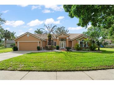 Charming single-story home with a well-manicured lawn and beautiful landscaping at 836 Copperfield Ter, Casselberry, FL 32707