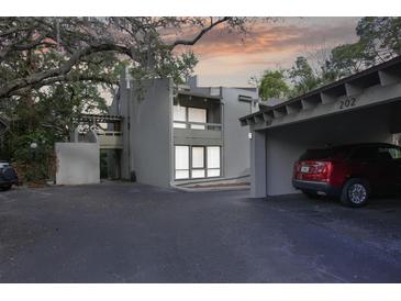 A charming condo featuring a covered carport and beautiful architectural details at 102 Fairway Dr # 102, Longwood, FL 32779