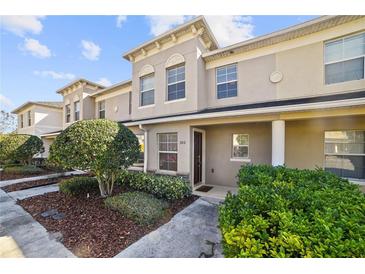 Charming townhouse with manicured landscaping and a welcoming front entrance, perfect for modern living at 380 Carina Cir, Sanford, FL 32773