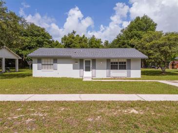 Charming single-story home with well-maintained lawn and gray shutters at 14796 Sw 39Th Cir, Ocala, FL 34473